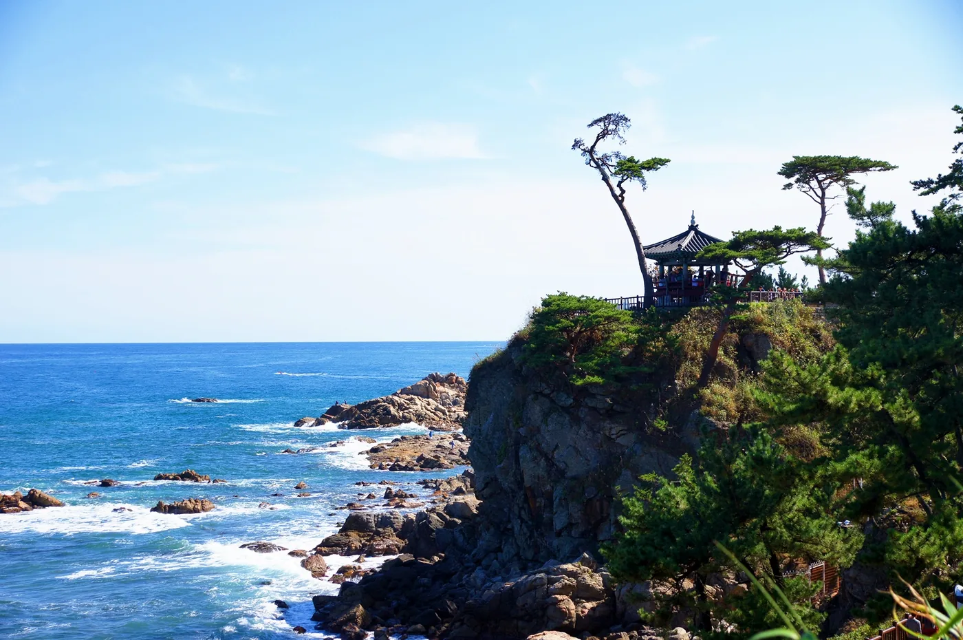 Uisangdae Pavilion among pine trees on the rocky coast at Naksansa Temple in Yangyang.