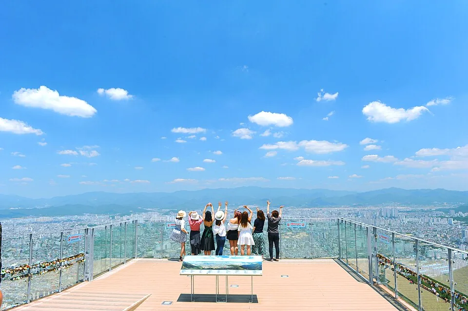 Travelers looking across Daegu from Apsan Observatory