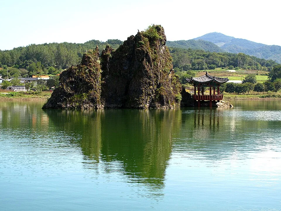 Dodamsambong rocks and a traditional pavilion reflected in the Namhan River near Danyang