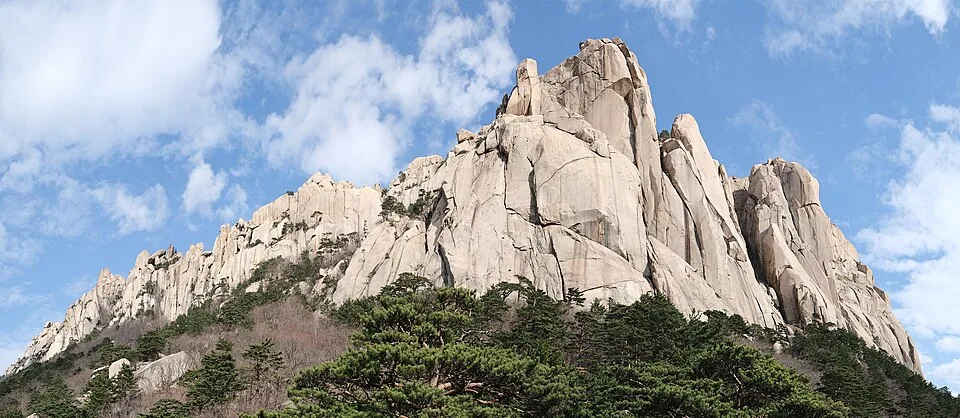 The granite cliffs of Ulsanbawi rise above pine trees in Seoraksan National Park